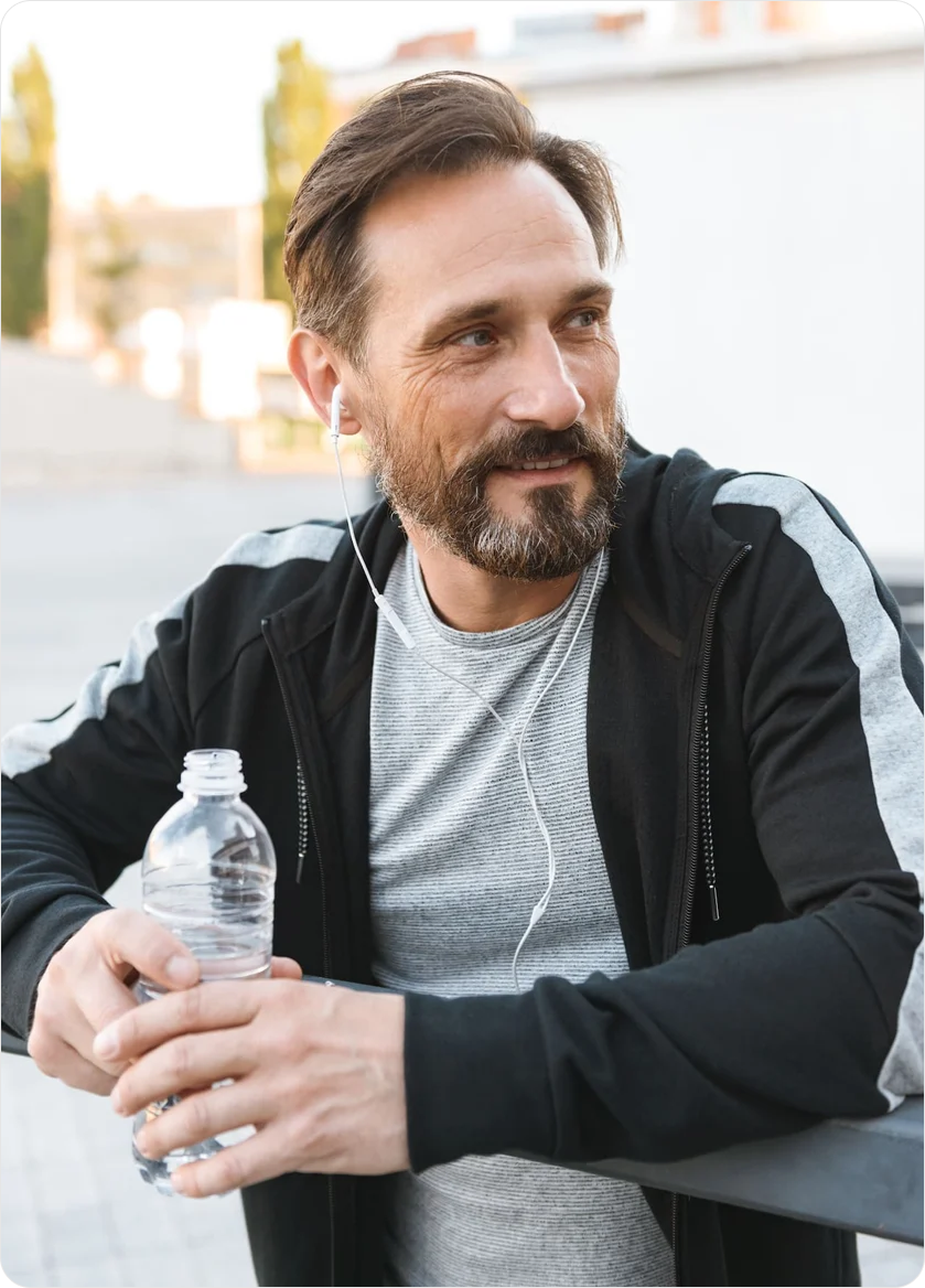 handsome-strong-mature-sportsman-holding-bottle-wi-2023-11-27-05-21-57-utc 1 (1)